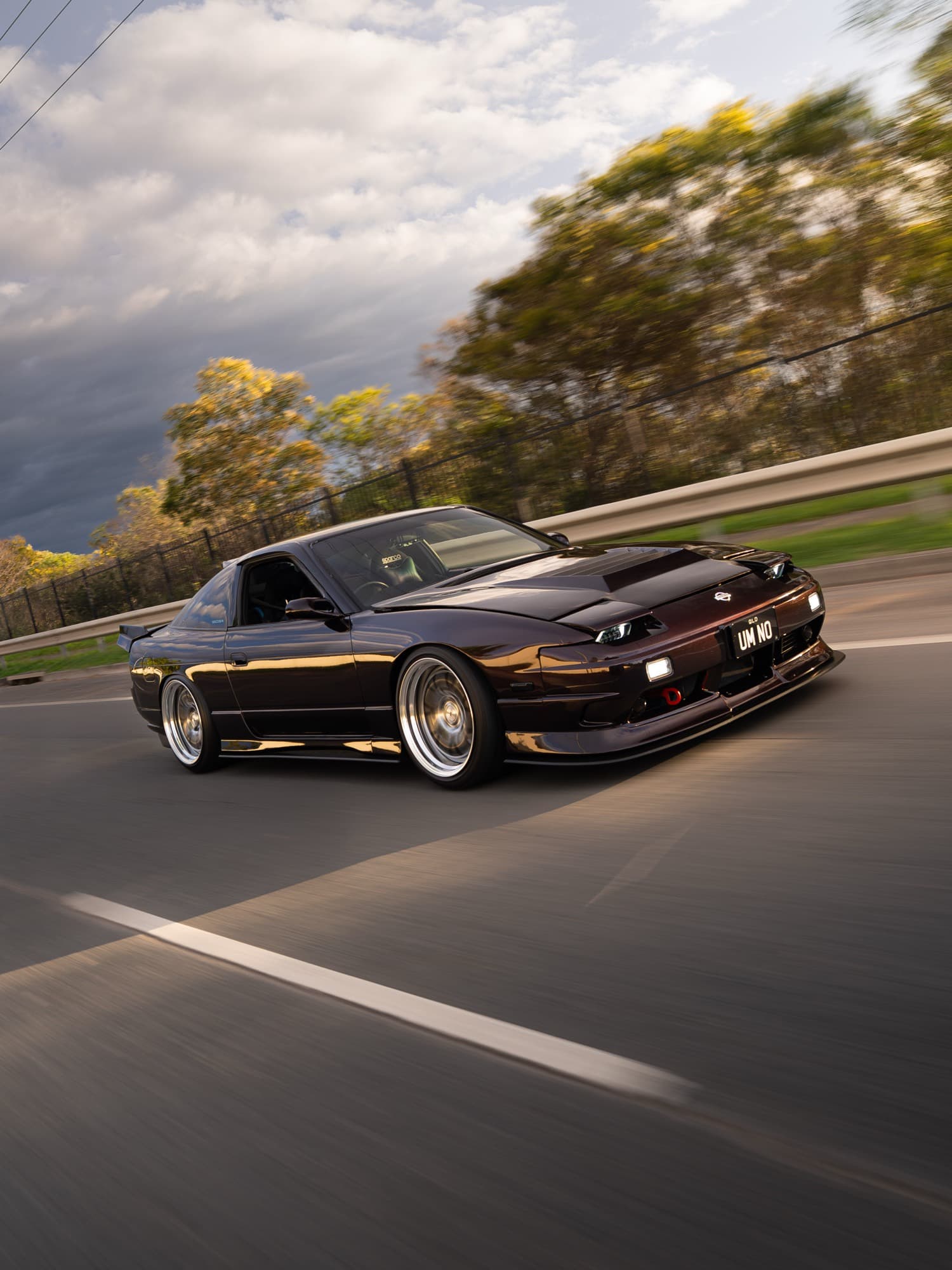 Nissan 180SX — highway rolling shot at golden hour