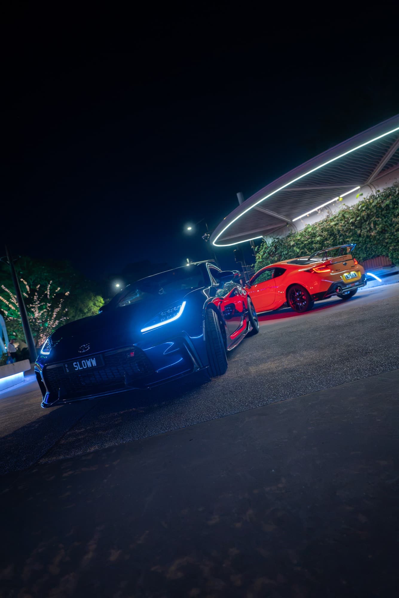 Sports coupe pair — night meet