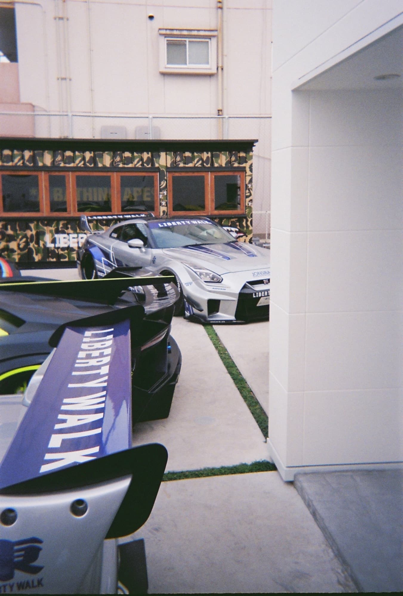 Liberty Walk Nissan GT-R R35 on the forecourt, Japan — 35mm film