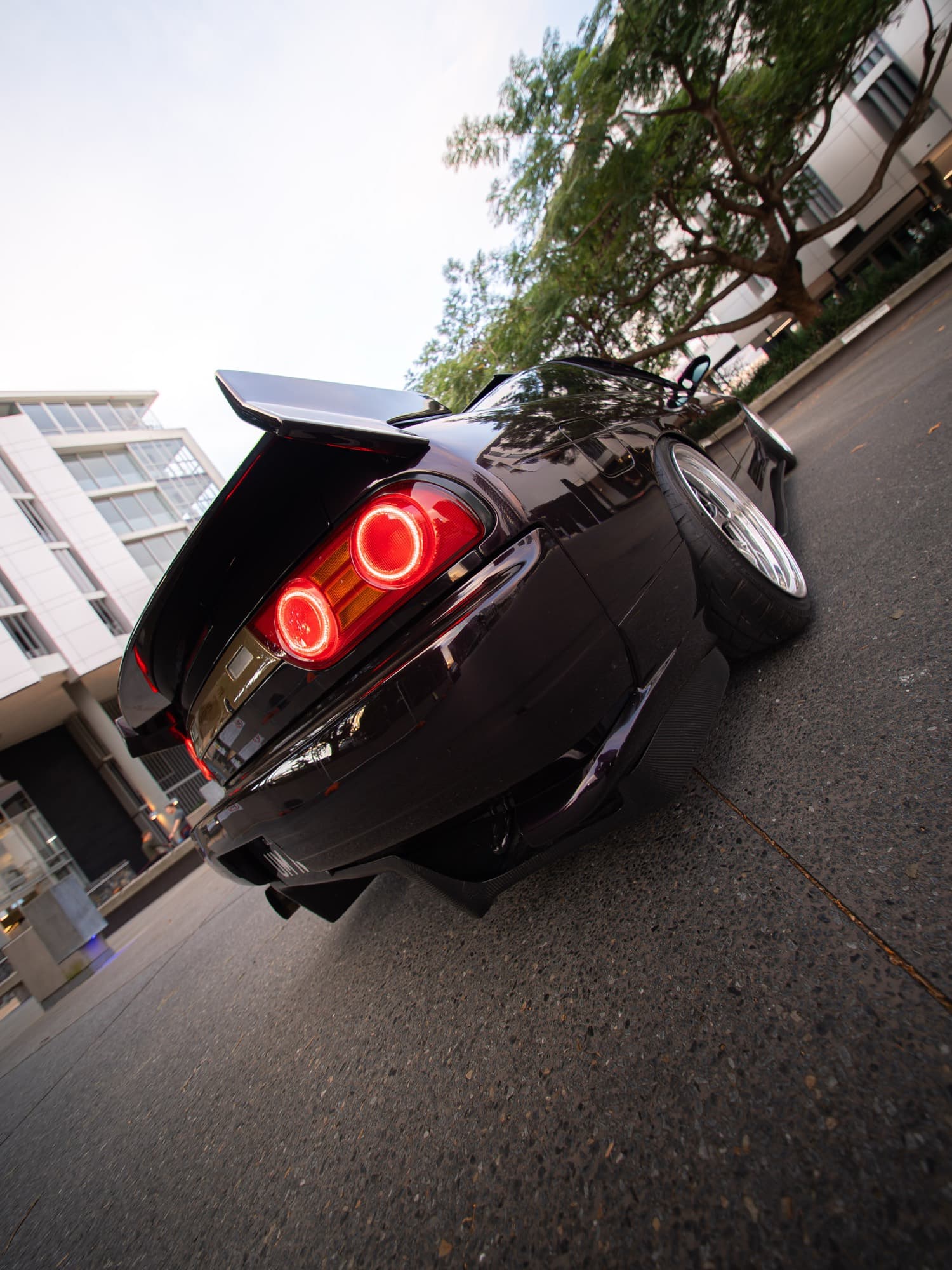 Stanced coupe — rear quarter detail