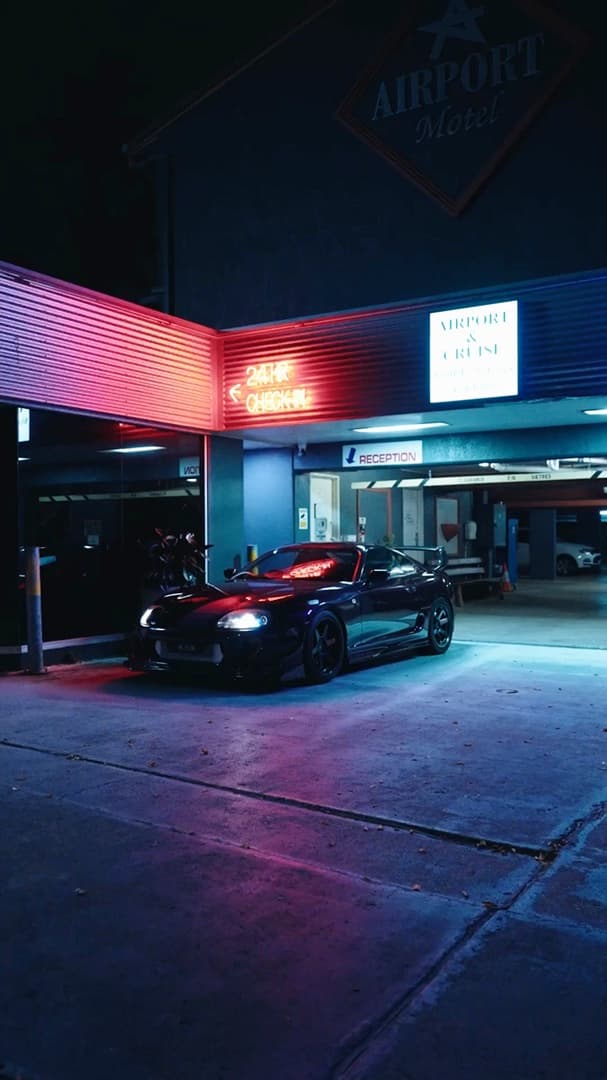 Toyota Supra — neon motel forecourt night reel